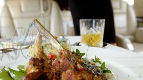 Camera holding lamb chops as financial graphs animating while flight attendant Video stock 317117534