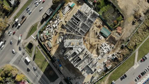 The camera hovered over the construction of the corner building. Near a busy Stock Footage 96354590