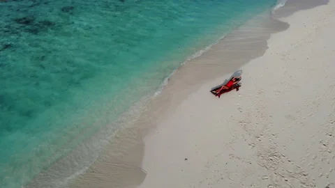 Camera Hovering Above Tropical Beach with Sexy Girl in Red Swimsuit and Tanned Stock Footage 149117518