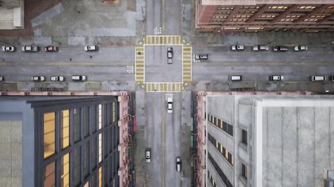 The camera, hovering high in the sky, flies quickly over a narrow street from Stock Photos