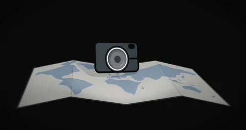Camera icon on a foldable world map take... | Stock Video | Pond5
