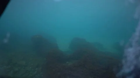 The camera is immersed under the water and over the sea in the drowning sea.  Stock Footage 190361101