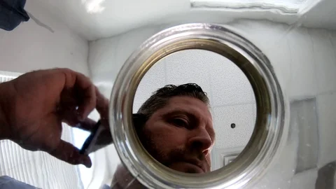 Camera is inside the camera and man is talking on phone and adds US dollar Stock Footage 108116013