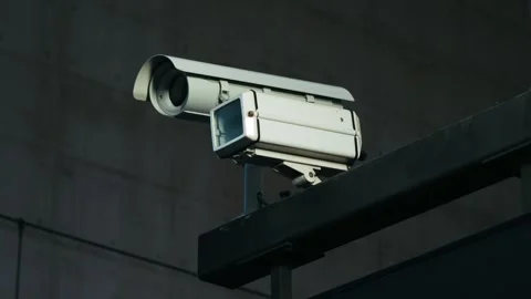 Camera installed on wall of the building. Scan the area for surveillance Stock Footage 310601316