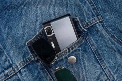 Camera in a jeans pocket Stock Photos