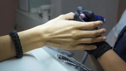 Camera jpge through the table of the manicure master in the beauty salon Stock Photos