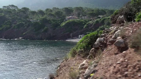 Camera lateral movement revealing small beach with cabins and kayaks in the s Video stock 132516994
