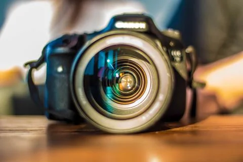 Camera with lens and light reflection Foto stock