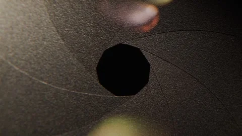 Camera lens aperture blades opening and closing in macro motion cinematic v.. Stock Footage 334764193