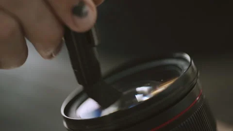 Camera lens cleaning, dust removal from dslr camera lens by lens pen Stock-Footage 152539924