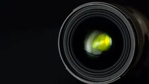 Camera lens close-up on black background Stock Footage 92567565