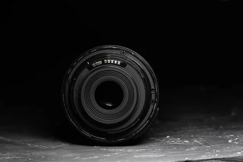 Camera lens on a dark background. Black background Stock Photos