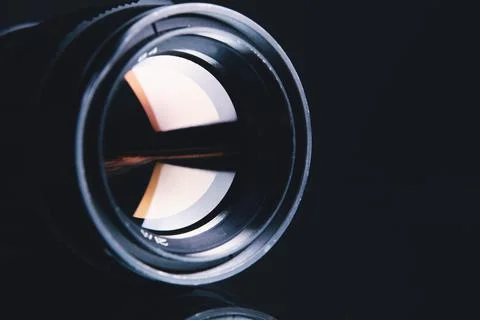 Camera lens on dark background Stock Photos