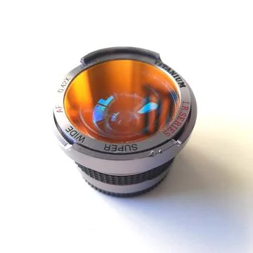 A camera lens featuring textured focus rings, red accent band Stock Photos