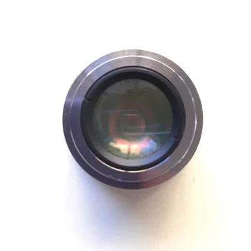 A camera lens featuring textured focus rings, red accent band Stock Photos