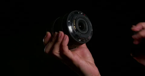 Camera Lens held in a hand Stock Footage 243269479
