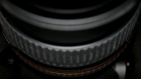 Camera lens tilt in light glare close up Stock Footage 87624679