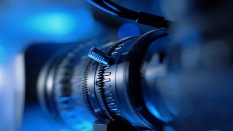 Camera lens with zoom ring moving. Turning zoom ring of modern tv camera Video stock 121369271