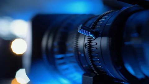 Camera lens with zoom ring moving. Turning zoom ring of modern tv camera Stock Footage 121660870