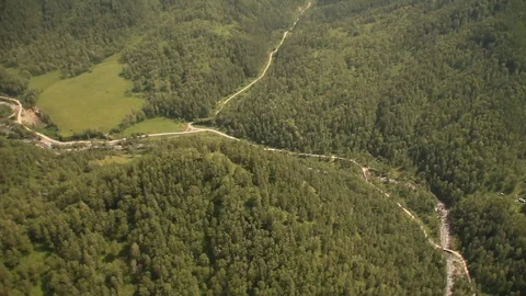 The camera in a light-engine plane flies in the mountains. Video stock 119995644