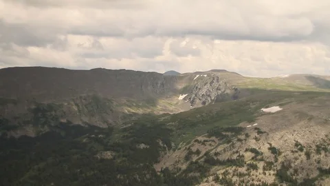 The camera in a light-engine plane flies in the mountains. 動画素材 119995679