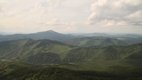 The camera in a light-engine plane flies in the mountains. 動画素材 119995712