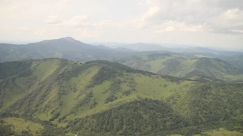 The camera in a light-engine plane flies in the mountains. Video stock 119995727