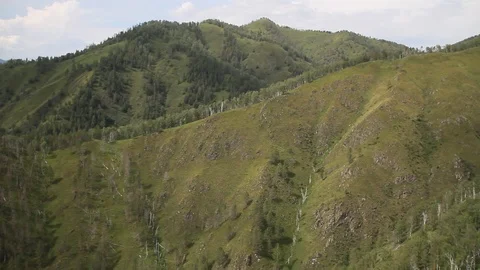 The camera in a light-engine plane flies in the mountains. Stock Footage 119995774