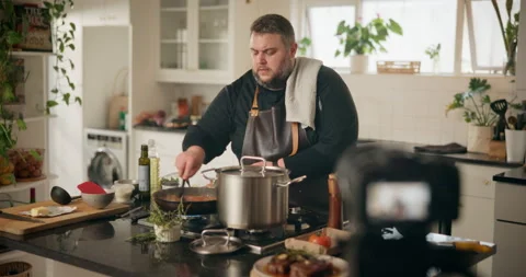Camera, live streaming and man in kitchen for cooking dinner, cuisine tutorial Stock Footage 283328407