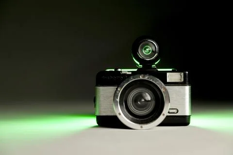 Camera lomo on infinite background and green lighting. Lomo concept. lomograp Foto stock