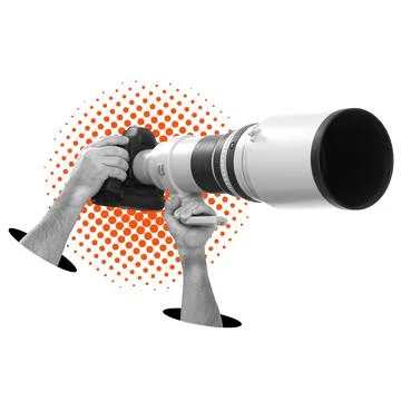 Camera with long lens held by hands on white background. Stock Photos