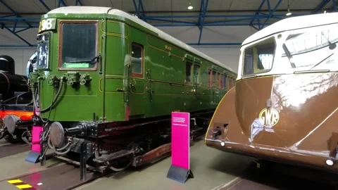The camera looks around at various types of locomotives - the railway museum Stock Footage 249351794