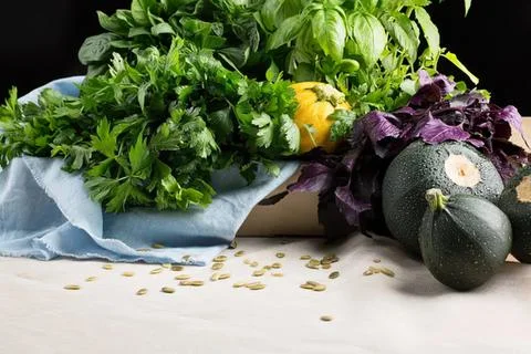 Camera lying on a table with green plant and keys Stock Photos