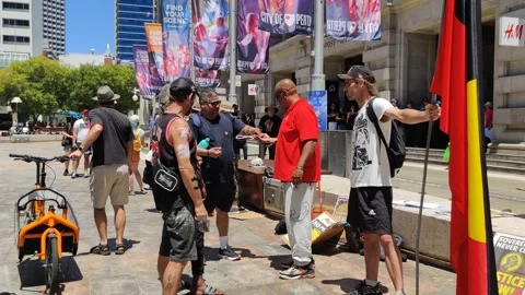 CAMERA MAN FILMS ABORIGINAL FLAG AT AUSTRALIA SURVIVAL INVASION DAY MARCH 2023 Stock Footage 231369355