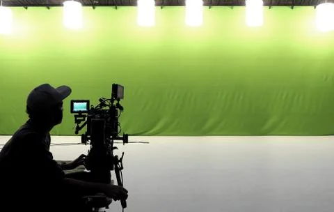 Camera man working in studio. Stock Photos
