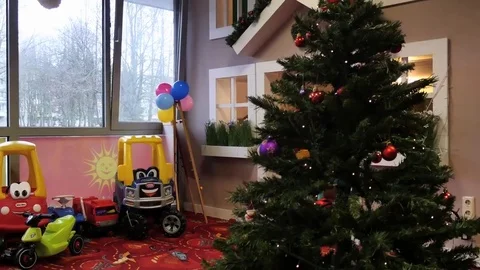 Camera motion around Christmas tree with festive decor and people background Video stock 83756102