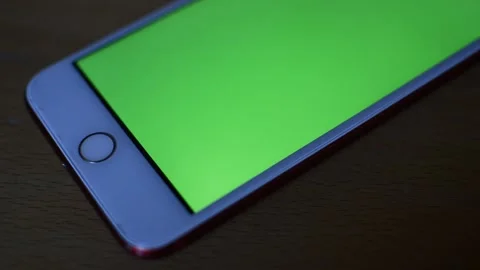 Camera motion on the iphone device with green screen display. Stock Footage 235990773