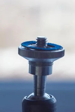 Camera mount with screw-thread close-up on a blurred background. instrument f Stock Photos
