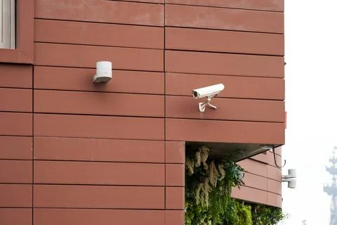 A camera is mounted on a building Stock Photos