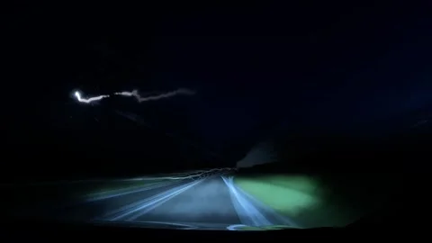 Camera mounted inside a car captures highway lights in motion blur with das.. Video stock 313995668