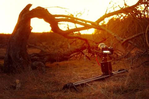 Camera mounted on motorized slider in sunset Stock Photos