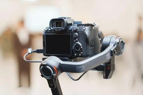 Camera mounted on a stabilizer for smooth video recording Stock Photos