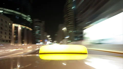 Camera Mounted on Taxi Rides Through Abu Dhabi Streets at Night Stock Footage 345157373