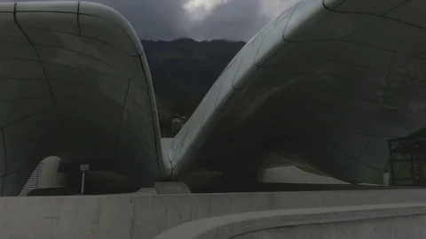 Camera move up along modern architecture shapes with the sky on the background Stock Footage 81934709