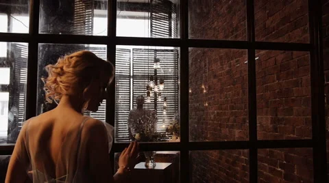 Camera move to the back of the bride and silhouette of her groom. Inspiration Stock Footage 61966030