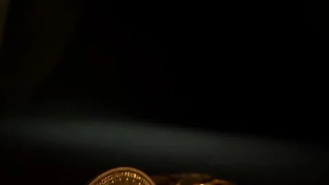Camera move down and open golden crypto money BITCOIN BTC on the foreground and Stock Footage 129865972
