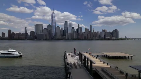 Camera move left through the pier and boat. New York city panorama Stock Footage 240687562