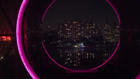 Camera move into round circle building hole Night modern chinese city background Stock-Footage 340625657