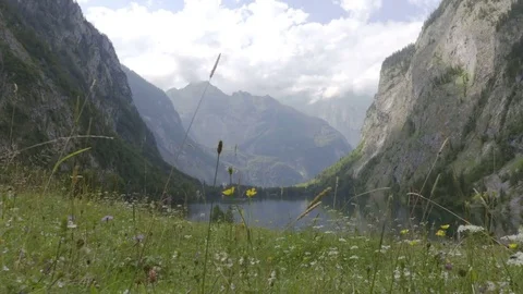 Camera move on the view in the lake between the mountains under the clouds Stock Footage 83526377