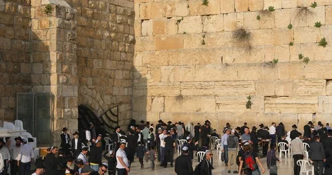 Camera moved along Western Wall from the entrance to synagogue Stock Footage 105075364